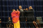 [Cadet Donte Jones Recieves His Bars from his parents at the 2016 Army ROTC Commissioning Ceremony]