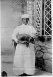 Woman Posing and Holding a Baby Pig