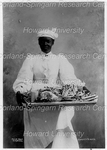 Woman Standing Holding a Tray of Comfits and Nuts by Poyer Bros.