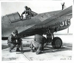 Six Soldiers Work on a P-40