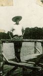 Unidentified Man Standing in the Corner of a Dock