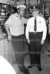 Joe Louis posing with Police Officer by Harold Hargis