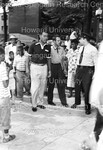 Joe Louis being escorted down the street by Harold Hargis
