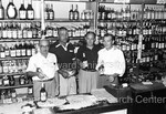 Joe Louis behind the counter of liquor store with 3 men - 1 by Harold Hargis