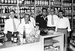 Joe Louis posing with 5 men at liquor store - 1 by Harold Hargis