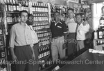 Joe Louis posing with 4 men behind the counter of a liquor store - 3 by Harold Hargis