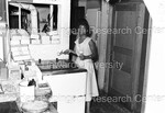 Unidentified woman scooping ice cream by Harold Hargis