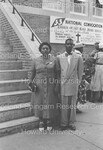 Unidentified Man and woman pictured standing outside of the church by Harold Hargis