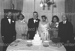 Bride and Groom pose with the parents of the newlyweds. by Harold Hargis