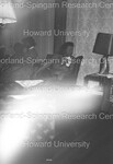 Blurred image of women sitting in a chair by Harold Hargis