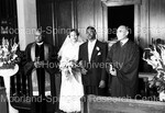Bride and Groom with 2 ministers; at the alter by Harold Hargis