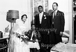 Bride and Groom with 2 unidentified people; 1 seated - 1 by Harold Hargis