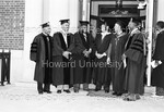 Howard University Faculty including Professor Alain Locke in regalia stnading in front of Douglass Hall, Howard University by Harold Hargis