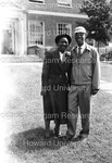 Man and Woman Pose for Photograph at Graduation outside of Founders Library by Harold Hargis