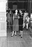 Two Women Pose for Photograph Standing together at Fraternity Social Event by Hargis Harold