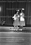Two of the Delta Sigma Theta Poodles take a picture by Hargis Harold