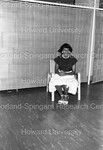 Woman Photographed in a Chair - 1 by Harold Hargis