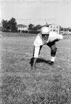 Football player in a football stance; 1 hand on the ground by Harold Hargis