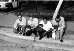 Group Photo of Howard University Students Kneeling on Sidewalk with "H" carved into their hair by Harold Hargis