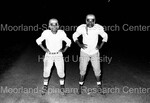 Two Football Players pose for Photographs by Harold Hargis