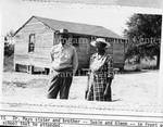 Susue and Glenn in Front of the Brick School that He Attended