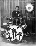 Man Seated at a Drumset