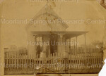 2 Unidentified Females and a Child Standing on the Front Porch of Their Home - edited