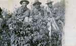 Three black soldiers sitting