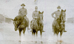 Three soldiers riding horses
